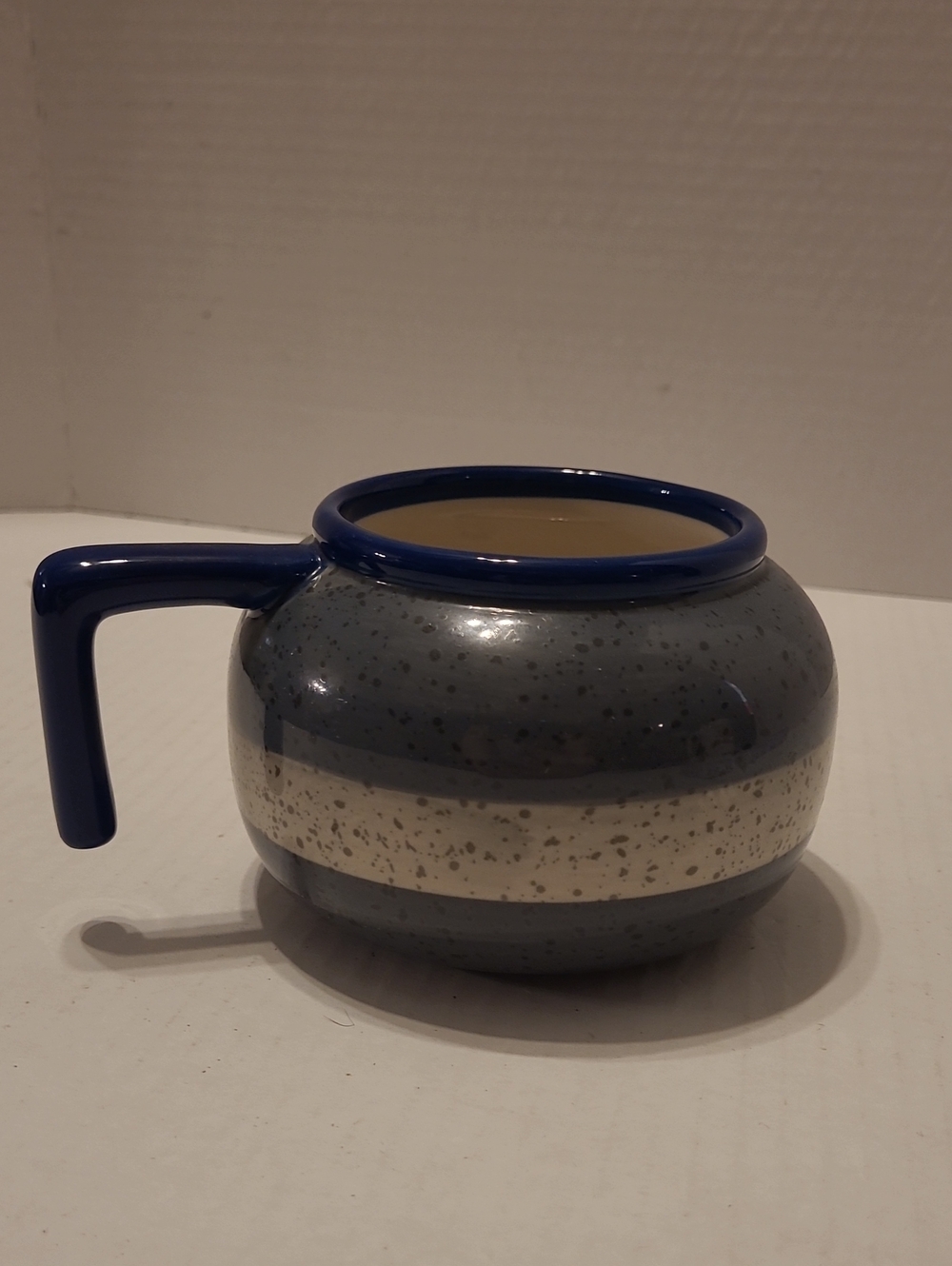 Curling Rock Mug by Main & Local, designed to resemble a granite curling stone